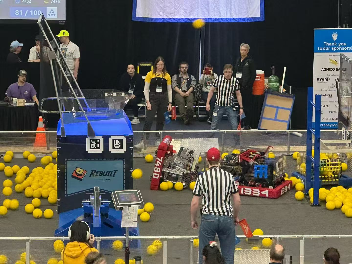 Robotics competition field with student-built robots.